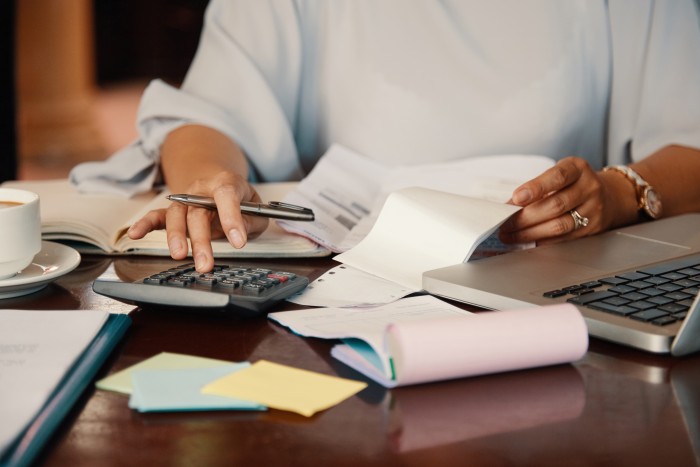 entrepreneur-working-with-bills (1)