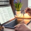 old-woman-reads-news-laptop-closeup-hands (1)